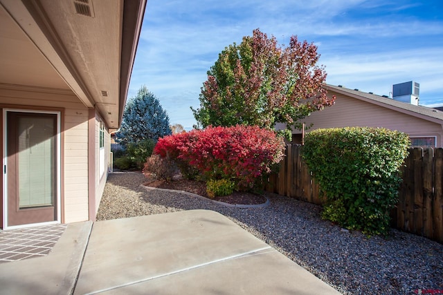 view of patio with a fenced backyard and visible vents