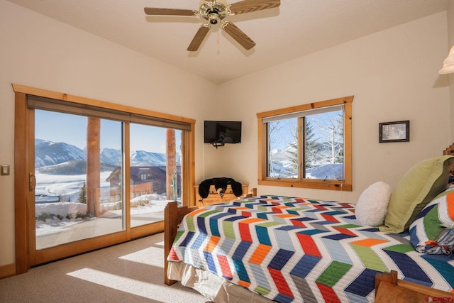 bedroom featuring carpet floors, access to exterior, vaulted ceiling, and a ceiling fan