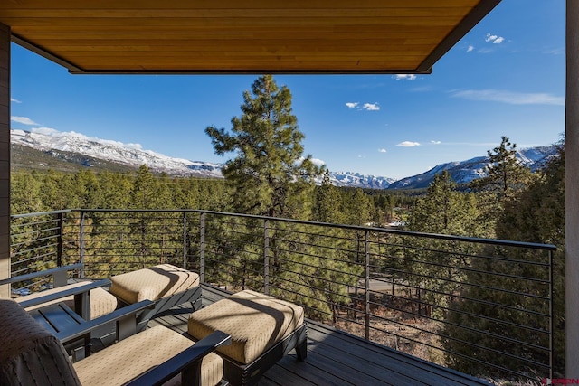 balcony with a mountain view and a wooded view