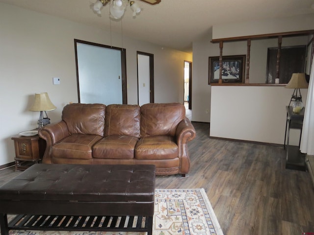 living area with wood finished floors and baseboards