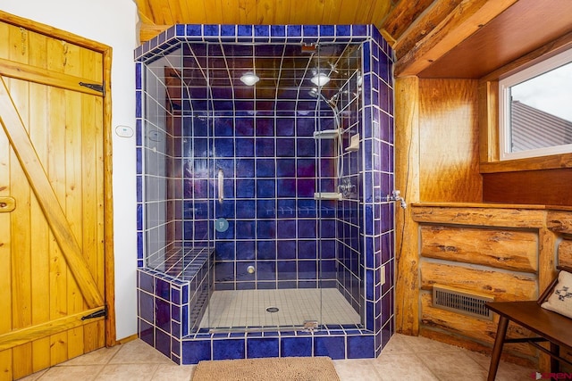 bathroom with a stall shower, tile patterned flooring, visible vents, and wooden ceiling