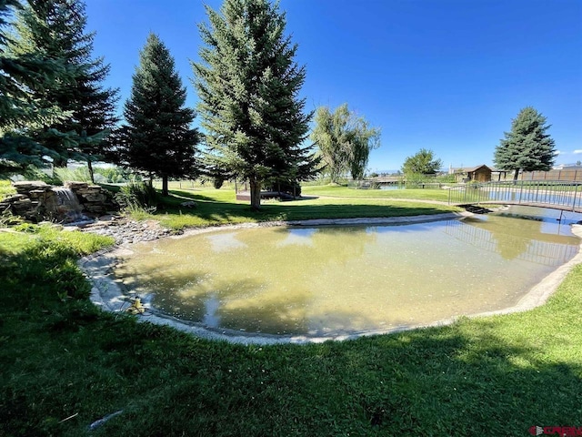 surrounding community featuring a lawn