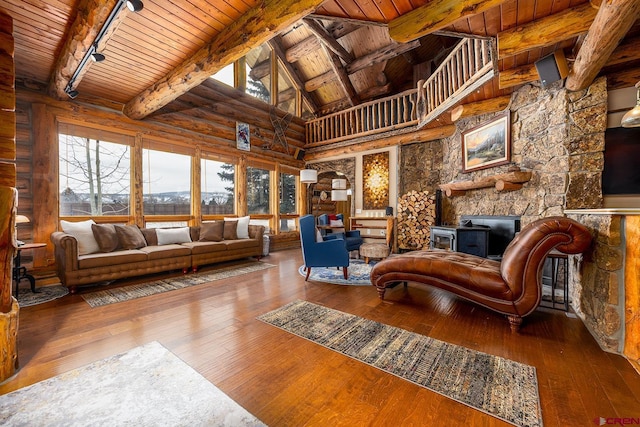 living room with plenty of natural light, a fireplace, wood-type flooring, and wood ceiling