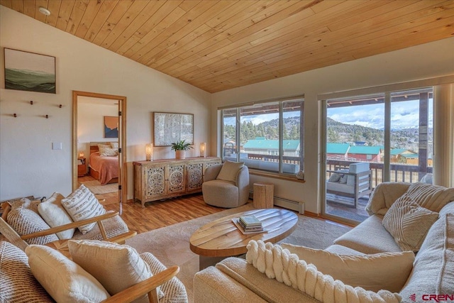 living room with wooden ceiling, vaulted ceiling, baseboard heating, and wood finished floors