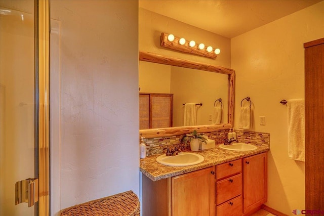 full bath with double vanity, tasteful backsplash, and a sink