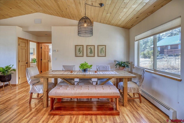 dining space with light wood-style floors, wooden ceiling, vaulted ceiling, and baseboard heating