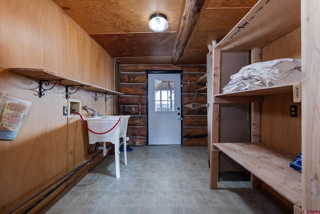 interior space with laundry area, washer hookup, a sink, and wood ceiling