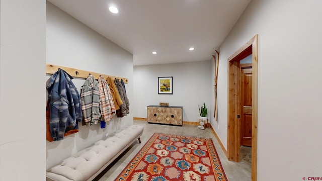 mudroom with recessed lighting and baseboards