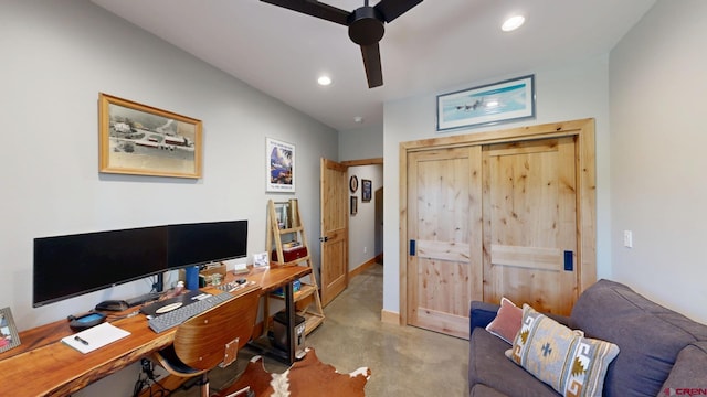 office area featuring finished concrete floors, recessed lighting, baseboards, and a ceiling fan