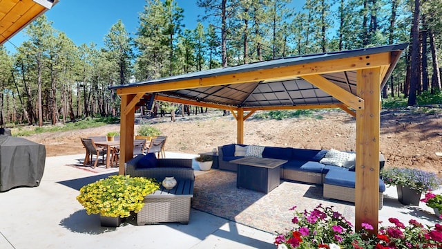 view of patio / terrace featuring outdoor dining area, an outdoor living space, a gazebo, and grilling area