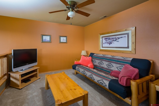 living room featuring carpet, visible vents, ceiling fan, and baseboards