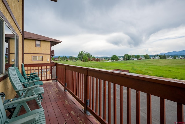 wooden deck with a mountain view