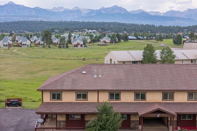 drone / aerial view featuring a mountain view