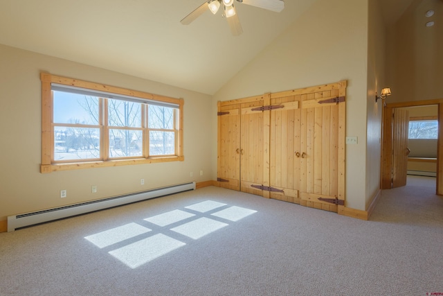 unfurnished bedroom with carpet, a baseboard radiator, high vaulted ceiling, and ceiling fan