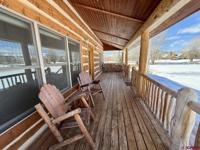 view of snow covered deck