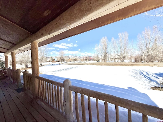 view of snow covered deck