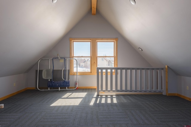 bonus room with carpet, lofted ceiling with beams, and baseboards