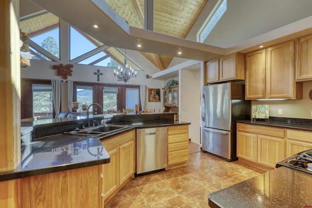 kitchen featuring lofted ceiling with beams, appliances with stainless steel finishes, an inviting chandelier, light brown cabinetry, and a sink