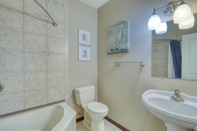 full bathroom with shower / bath combo with shower curtain, a sink, and toilet