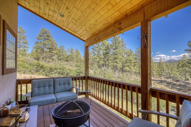 wooden terrace with a forest view