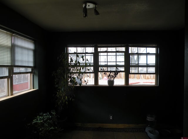 unfurnished room with tile patterned floors