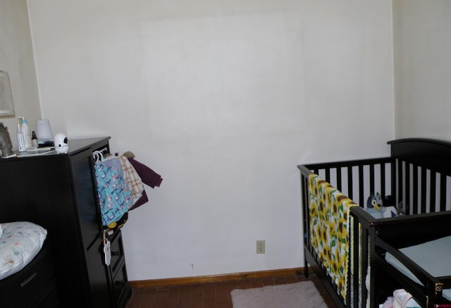 bedroom featuring baseboards