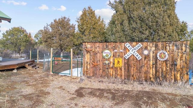 exterior space with a gate and fence