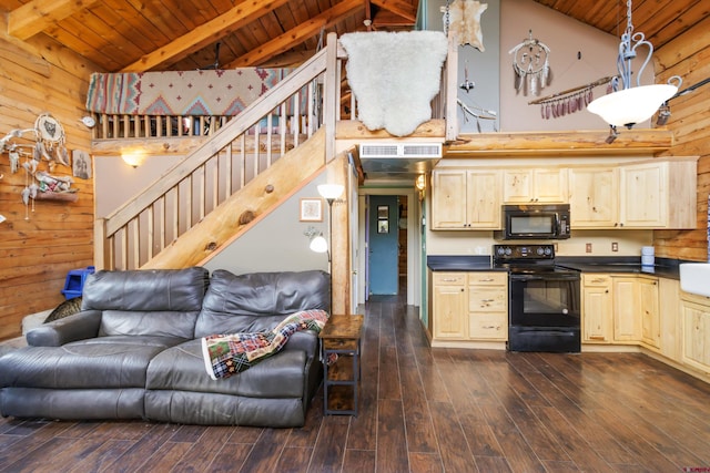 kitchen with dark countertops, open floor plan, wood walls, wooden ceiling, and black appliances