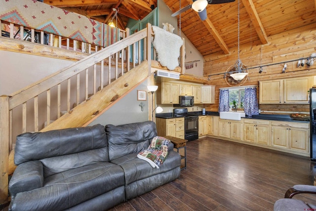 living room featuring ceiling fan, wooden ceiling, stairs, beamed ceiling, and dark wood finished floors