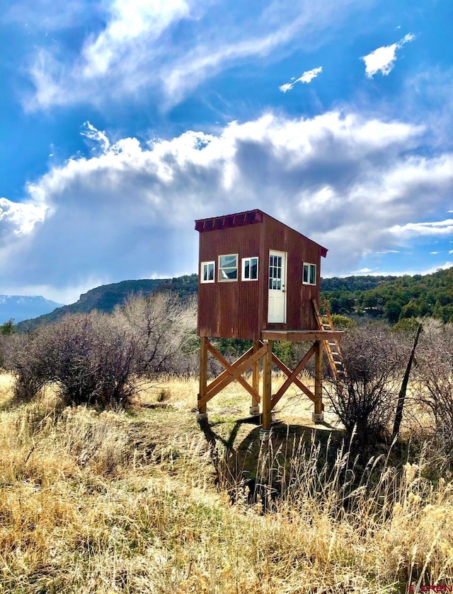 exterior space featuring a mountain view