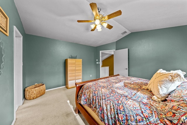 bedroom featuring lofted ceiling, ceiling fan, a textured wall, carpet floors, and baseboards