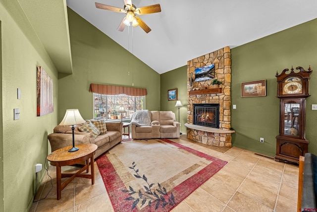 tiled living area with ceiling fan, high vaulted ceiling, and a fireplace