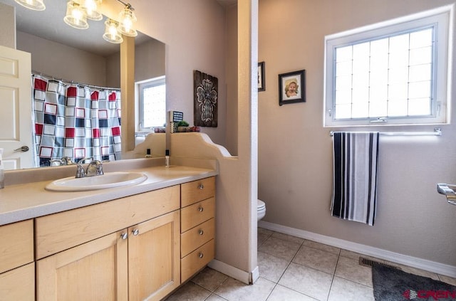 full bath with baseboards, toilet, tile patterned flooring, vanity, and a notable chandelier