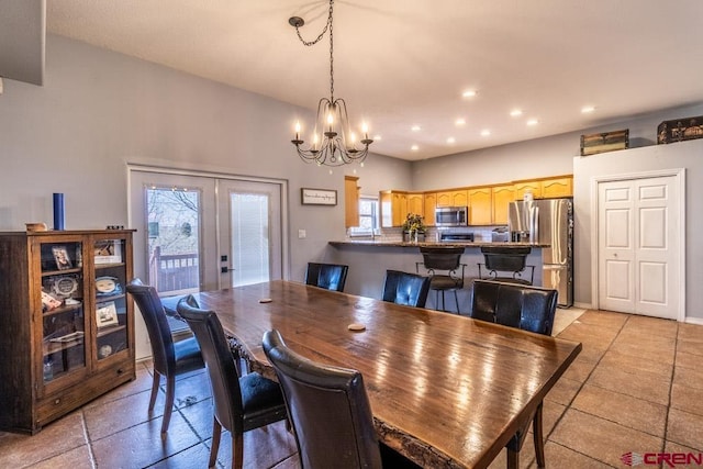 dining room featuring a notable chandelier, french doors, and recessed lighting