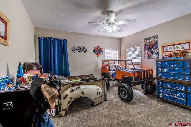 bedroom with carpet, ceiling fan, and a textured ceiling