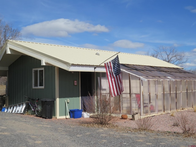 exterior space featuring metal roof