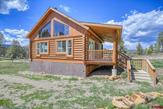 view of side of property featuring log exterior