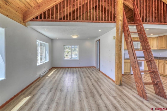 unfurnished living room featuring light wood-type flooring, baseboards, and a baseboard heating unit