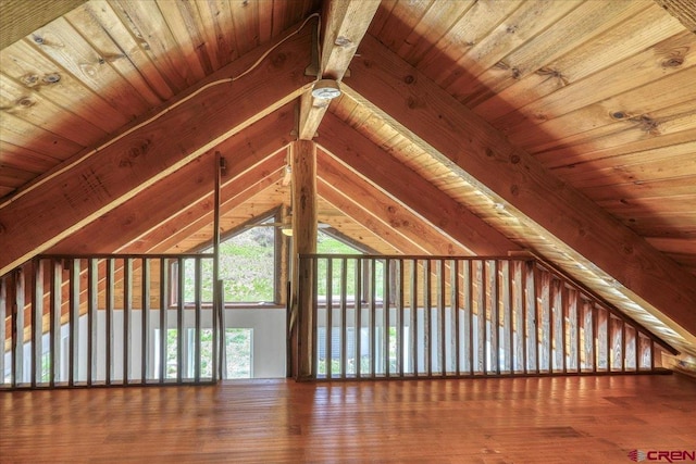 bonus room with vaulted ceiling with beams, wood ceiling, and wood finished floors