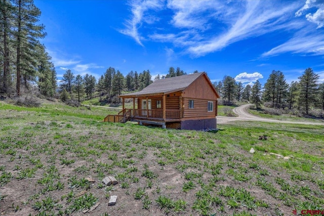 view of side of property with log exterior