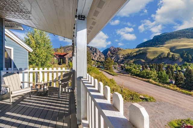 wooden terrace featuring a mountain view