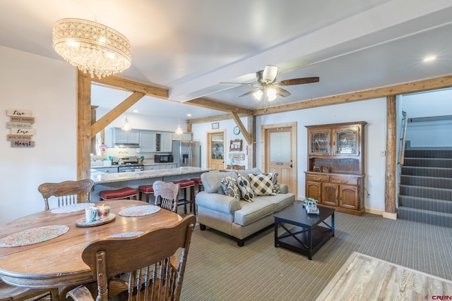 living area featuring stairs, recessed lighting, beamed ceiling, baseboards, and ceiling fan with notable chandelier