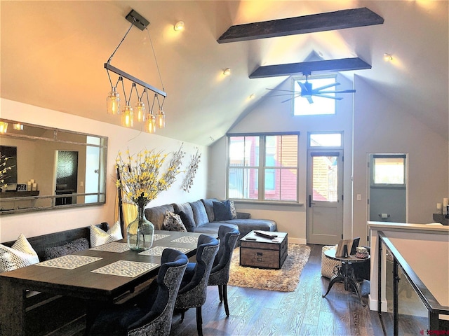 dining area featuring beam ceiling, high vaulted ceiling, and wood finished floors