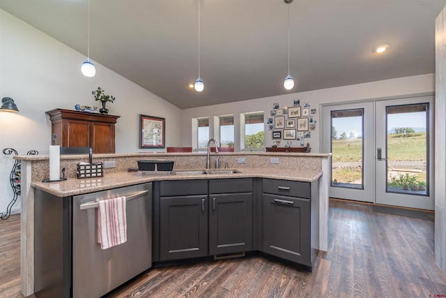 kitchen featuring lofted ceiling, stainless steel dishwasher, a sink, and a healthy amount of sunlight