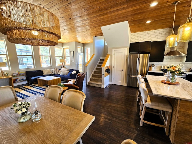 dining area with baseboards, wooden ceiling, dark wood-style floors, stairs, and recessed lighting