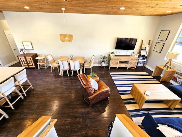 living room featuring wooden ceiling, baseboards, and wood finished floors