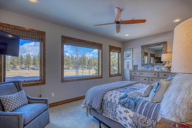 bedroom with light carpet, baseboards, a ceiling fan, and recessed lighting