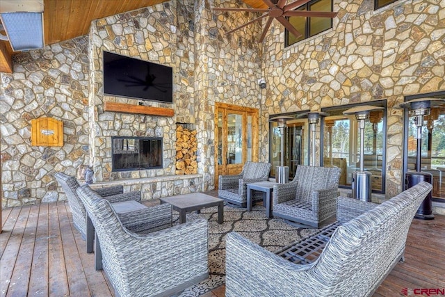 interior space featuring an outdoor hangout area and a wooden deck