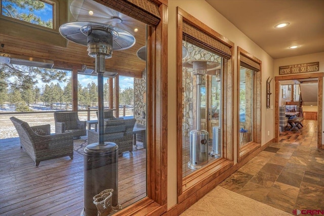 interior space featuring stone finish flooring and recessed lighting