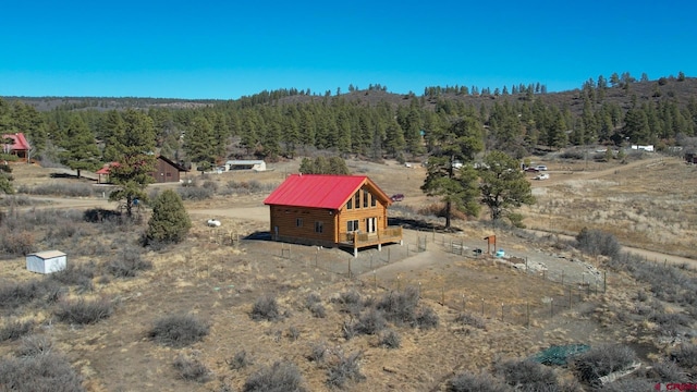 bird's eye view with a forest view and a rural view